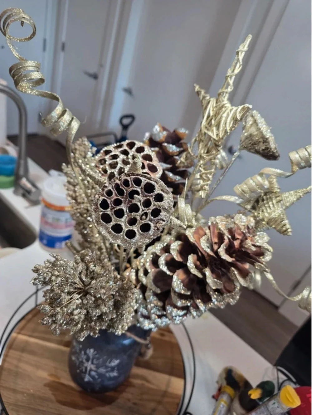 Rustic Decorative Pinecone and Star Arrangement in Glass Vase